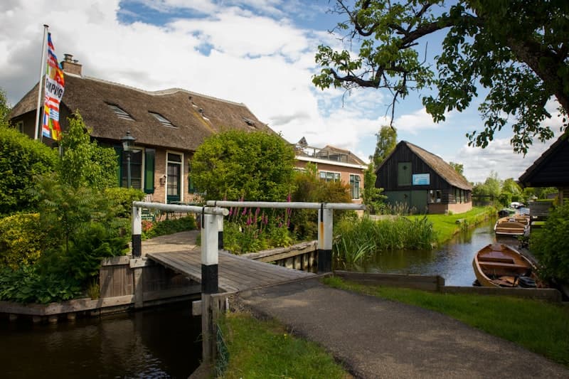 Thatched holiday cottage on a canal in Giethoorn, Netherlands