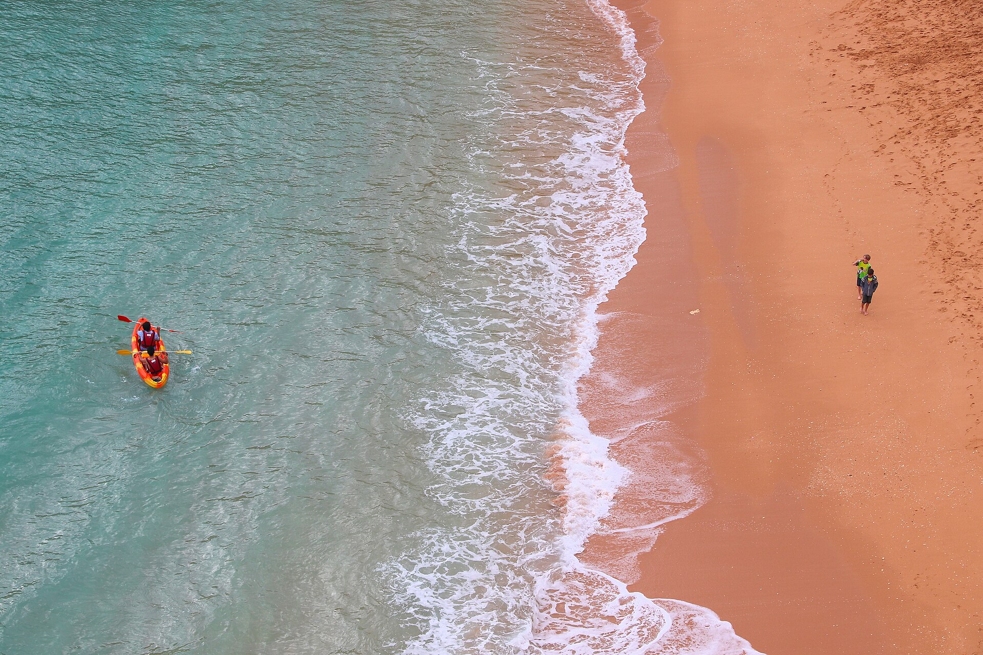 Kayak on turquoise water at Benagil beach, Algarve — Brixfox cross-market Airbnb earnings data, 2026